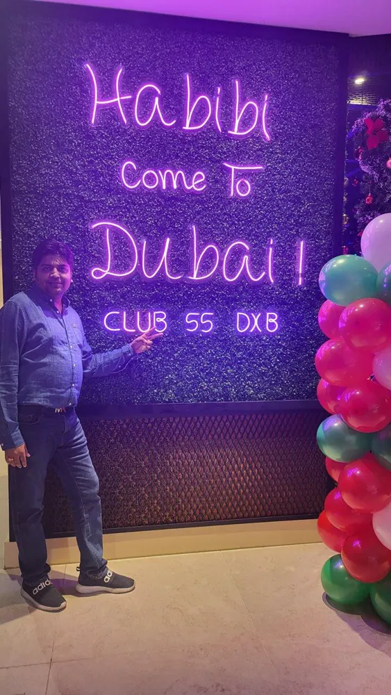 Ritesh in Dubai under a Habibi Come to Dubai sign
