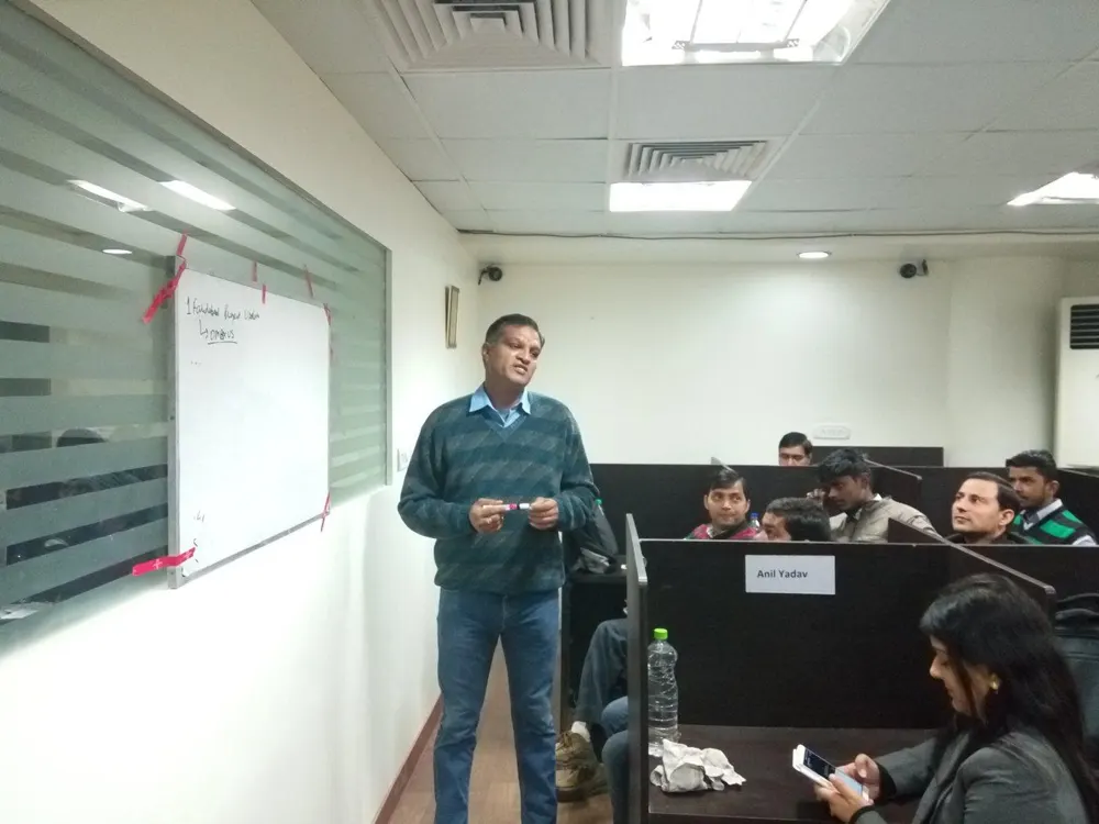 Ritesh leading a team session at VR Infobuild